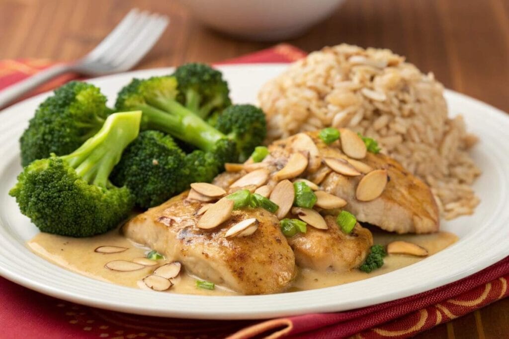 Is almond chicken healthy? A nutritious plate of almond chicken with broccoli and brown rice.